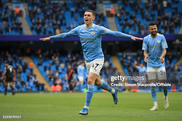 Phil Foden of Manchester City celebrates after scoring their 3rd goal during the Premier League match between Manchester City and Everton at Etihad...