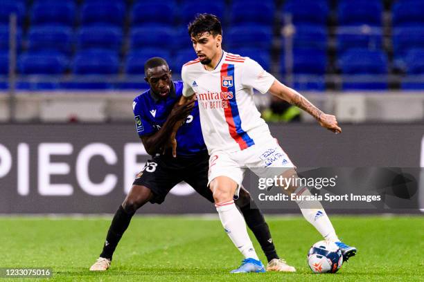 Lucas Paqueta of Olympique Lyon plays against Hassane Kamara of Nice during the Ligue 1 match between Olympique Lyon and OGC Nice at Groupama Stadium...