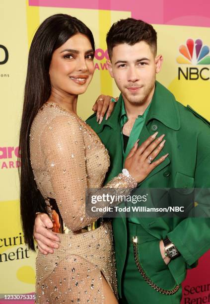 Pictured: Priyanka Chopra and Nick Jonas of Jonas Brothers arrive to the 2021 Billboard Music Awards held at the Microsoft Theater on May 23, 2021 in...