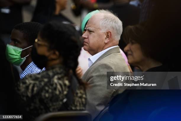 Minnesota Governor Tim Walz listens as Rev. Al Sharpton speaks outside the Hennepin County Government Center on May 23, 2021 in Minneapolis,...