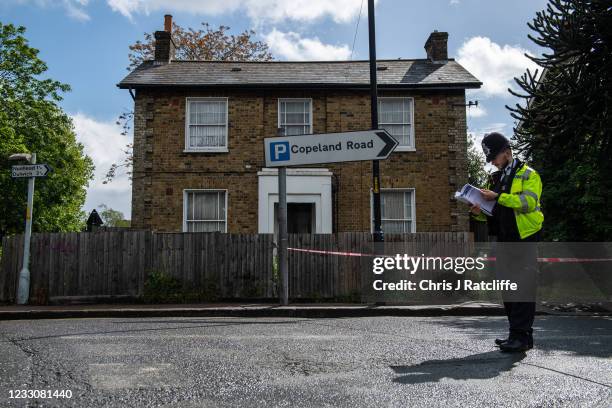 Police officer stands at a cordon on Consort Road where they are investigating the shooting of Sasha Johnson on May 24, 2021 in London, England. Ms...