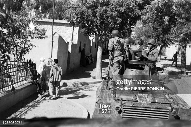 French army machine gun patrols the streets of Arris in the wilaya of Batna on November 8 while reinforcements have been sent to Algeria to counter...