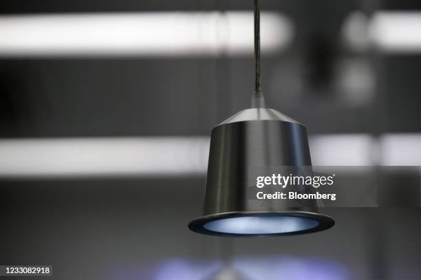 Light fixture in the shape of a Nespresso pod at Nestle SA's Nespresso plant in Avenches, Switzerland, on Thursday, May 20, 2021. Nestle SA sales...