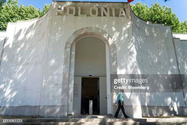 Visitor passes Poland's pavilion at the Giardini della Biennale during the Biennale of Architecture in Venice, Italy, on Thursday, May 20, 2021. This...