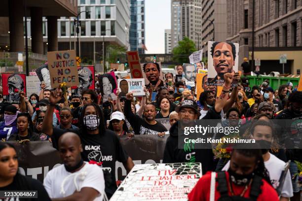 People participate in the inaugural remembrance rally and march hosted by the George Floyd Global Memorial, commemorating the first anniversary of...