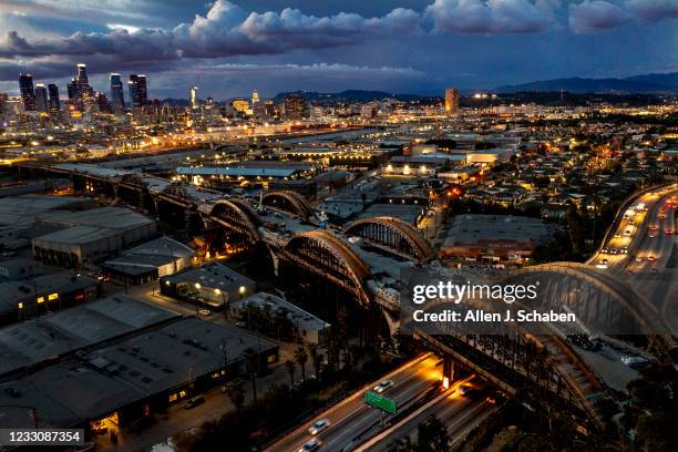 April 15: An aerial view of a dramatic sky over the Los Angeles skyline as progress is underway on the Sixth Street Viaduct Replacement Project that...