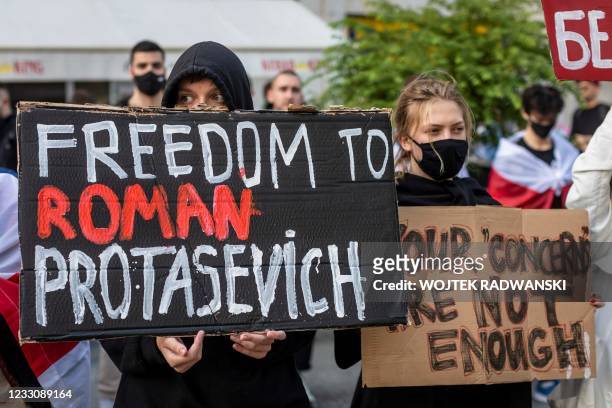 Belarusians living in Poland and Poles supporting them hold up a placard reading 'Freedom to Roman Protasevich' during a demonstration in front of...