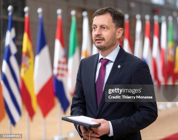 Slovak Prime Minister Eduard Heger talks to media as he arrives for an extraordinary EU Summit on May 24, 2021 in Brussels, Belgium. European Union...