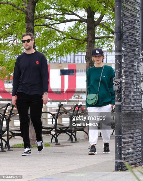 Jennifer Lawrence is seen out for a walk by the Hudson river with her husband Cooke Maroney on May 24, 2021 in New York City, New York.