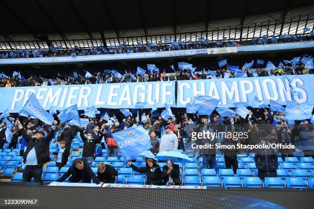 Manchester City fans display a banner proclaiming themselves Champions before the Premier League match between Manchester City and Everton at Etihad...
