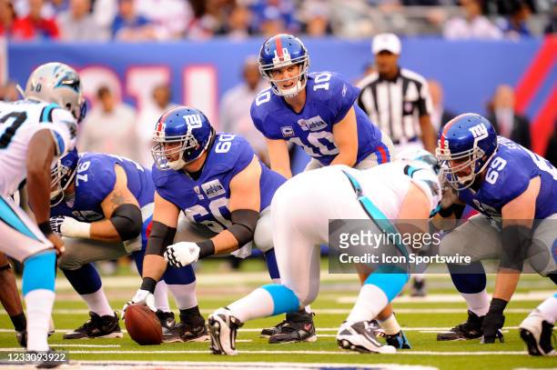 New York Giants quarterback Eli Manning lines up over New York Giants center Shaun O'Hara during the first half of the Carolina Panthers vs New York...