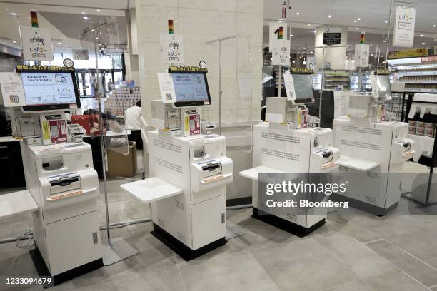 Cash registers for "Regi Go" service at a check-out area inside an Aeon Style store, operated by Aeon Retail Co., a unit of Aeon Co., during a media...