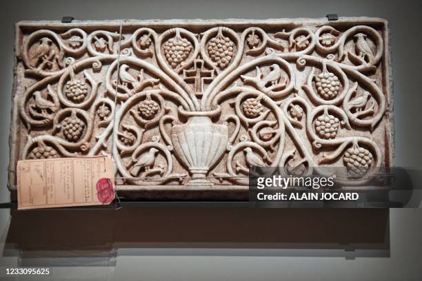 Carved marble bas-relief seized by French customs authorities at Roissy Airport in 2016 in transit between Lebanon and Thailand is desplayed at the...
