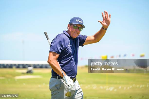 Phil Mickelson smiles and waves to fans on the practice range during the final round of the PGA Championship on The Ocean Course at Kiawah Island...