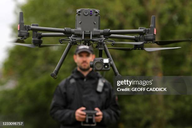 Acting Police Sergeant Chris Linzey pilots a DJI Matrice M300 drone during a demonstration for media ahead of the upcoming in-person G7 Summit to be...