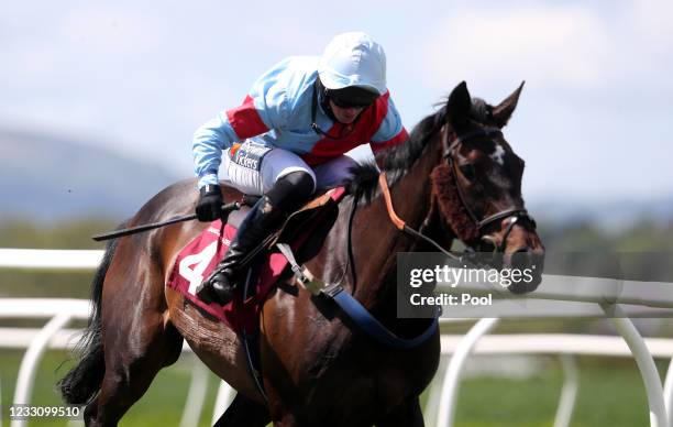 Mossing ridden by jockey Ben Poste on their way to winning the Penley Novices' Handicap Hurdle at Bangor-on-Dee Racecourse on May 25, 2021 in...