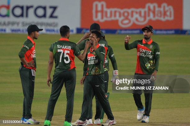 Bangladesh's Shakib Al Hasan celebrates with teammates after the dismissal of Sri Lanka's Dhananjaya de Silva during the second one-day international...