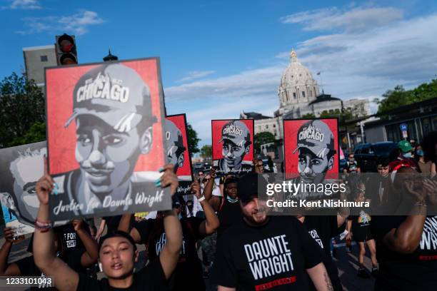 People participate in a march from the Minnesota State Capitol in remembrance of George Floyd and to call for justice for those who lost loved ones...