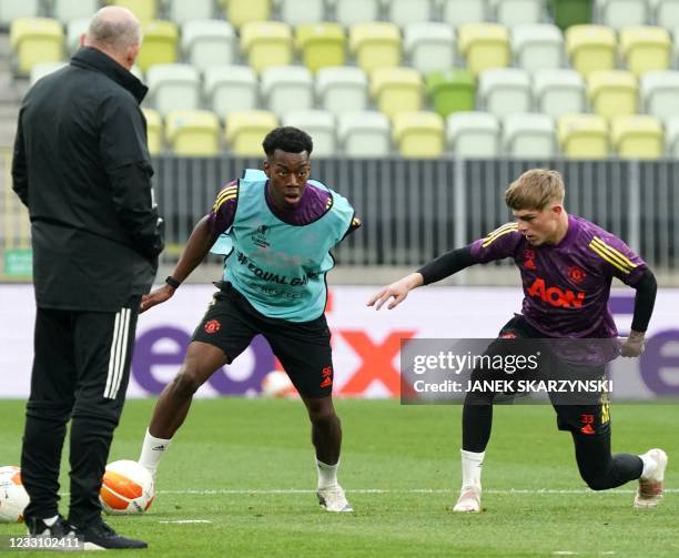Manchester United's Anthony Elanga and Manchester United's English defender Brandon Williams attends a training session on the eve of the UEFA Europa...