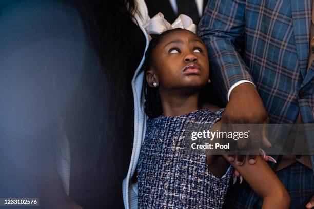 Gianna Floyd, the daughter of George Floyd, looks on as House Speaker Nancy Pelosi of Calif., center, speaks as she and Rep. Karen Bass, D-Calif.,...