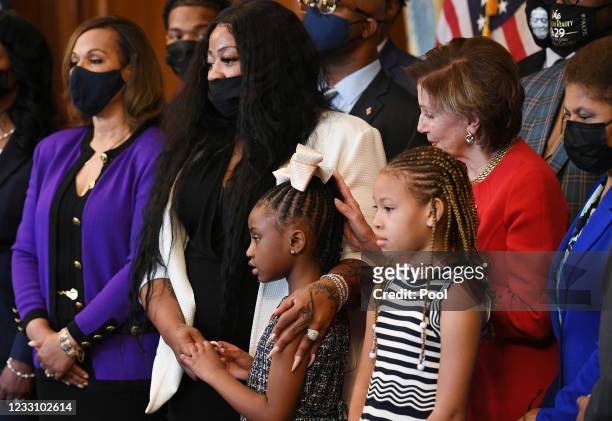 House Speaker Nancy Pelosi , D-CA, places her hand on Gianna Floyd, the daughter of George Floyd, with meeting with the Floyd family in the Rayburn...