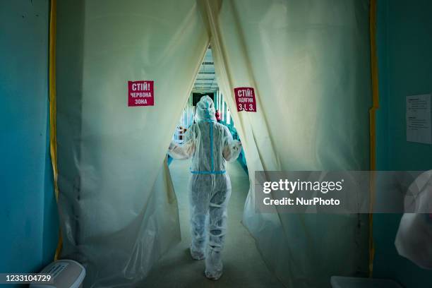 Health worker enters in an area with covid-19 patients with extreme situation in the intensive cares area of a hospital in Kyiv, Ukraine, on May 25,...