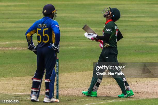 Bangladesh's Mushfiqur Rahim reacts after scoring a half-century during the second one-day international cricket match between Bangladesh and Sri...