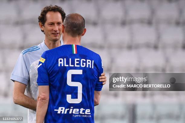 Fiat Chrysler Automobiles Chairman John Elkann chats with Former Juventus' coach Massimiliano Allegri during the charity football match between the...