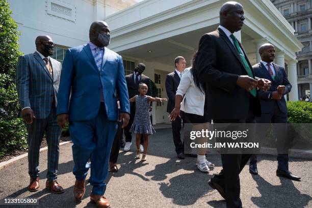 George Floyds daughter Gianna Floyd reaches out as members of George Floyds family departs the White House after meeting with US President Joe Biden...