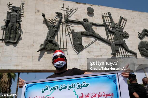 Protesters take a part in an anti-government protest on May 25, 2021 in Baghdad, Iraq. Protesters from across the country gathered in Baghdad...