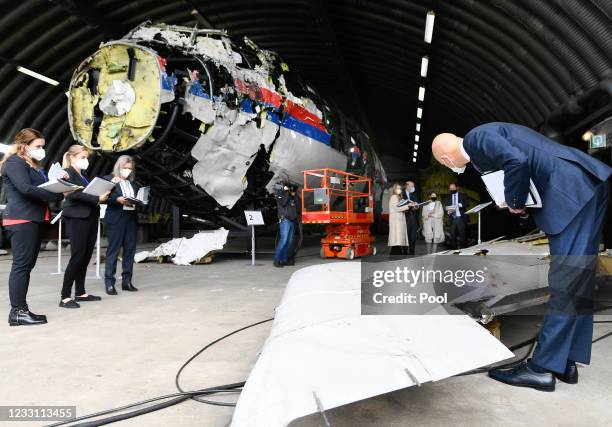 Presiding Judge Hendrik Steenhuis inspects the reconstruction of the MH17 wreckage, as part of the murder trial ahead of the beginning of a critical...