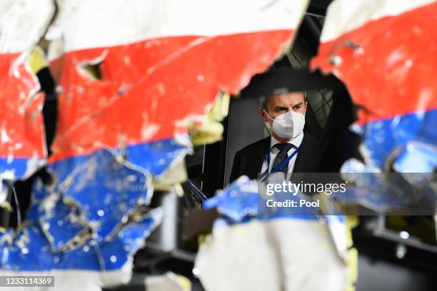 Substitute judge Daan Glass inspects the reconstruction of the MH17 wreckage, as part of the murder trial ahead of the beginning of a critical stage,...