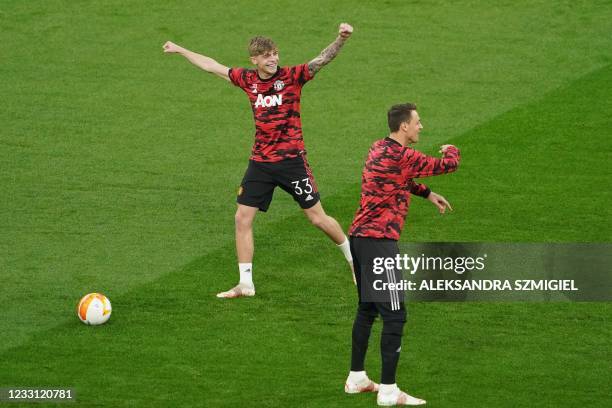 Manchester United's English defender Brandon Williams warms up before the UEFA Europa League final football match between Villarreal and Manchester...