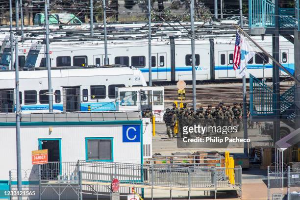 Tactical law enforcement officers move through the Valley Transportation Authority light-rail yard where a mass shooting occurred on May 26, 2021 in...