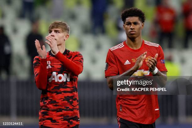 Manchester United's English striker Marcus Rashford Manchester United's English defender Brandon Williams applauds after the UEFA Europa League final...
