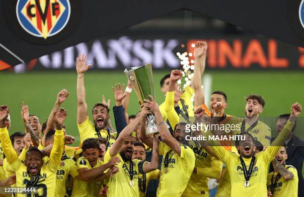 Villarreal's players celebrate with the trophy after winning the UEFA Europa League final football match between Villarreal CF and Manchester United...