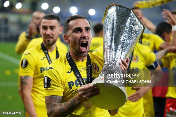 Villarreal's Spanish forward Paco Alcacer celebrates with the trophy after winning the UEFA Europa League final football match between Villarreal CF...