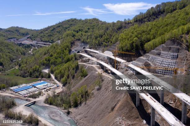 An aerial views shows a part of the new highway connecting the city of Bar on Montenegros Adriatic coast to landlocked neighbour Serbia, on May 11...