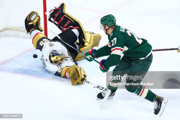 Nick Bjugstad of the Minnesota Wild scores a goal on Marc-Andre Fleury of the Vegas Golden Knights during the third period in Game Six of the First...