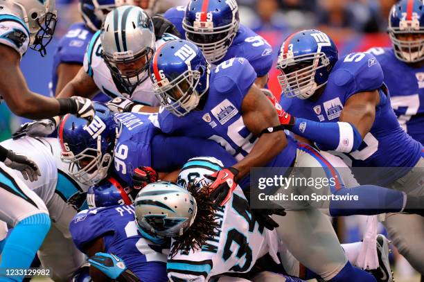 Carolina Panthers running back DeAngelo Williams gets tackled by New York Giants safety Kenny Phillips , defensive tackle Barry Cofield , safety...