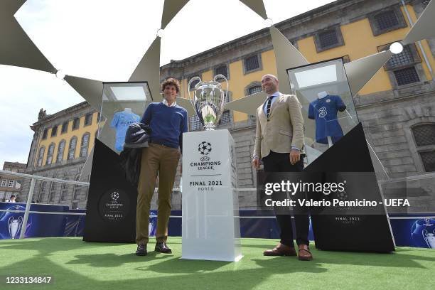 Fans poses for a photo with the trophy ahead of the UEFA Champions League Final between Manchester City and Chelsea at Estadio do Dragao on May 27,...