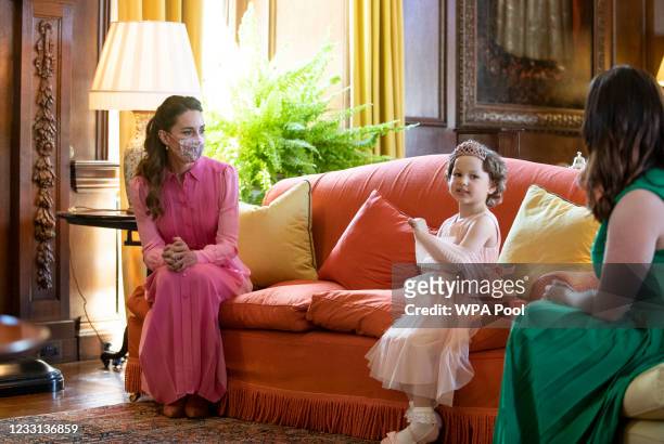 Catherine, Duchess of Cambridge during her meeting with Mila Sneddon, aged five, and her family, at the Palace of Holyroodhouse on May 27, 2021 in...