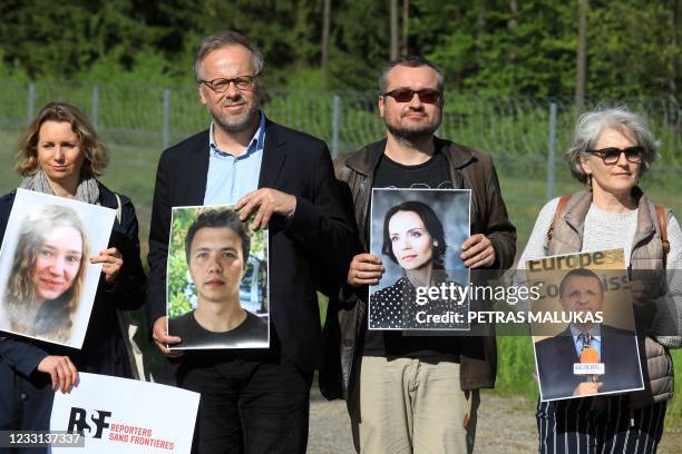 Secretary General and Executive Director of Reporters Without Borders Christophe Deloire poses with a photo of detained Belarus journalist Roman...