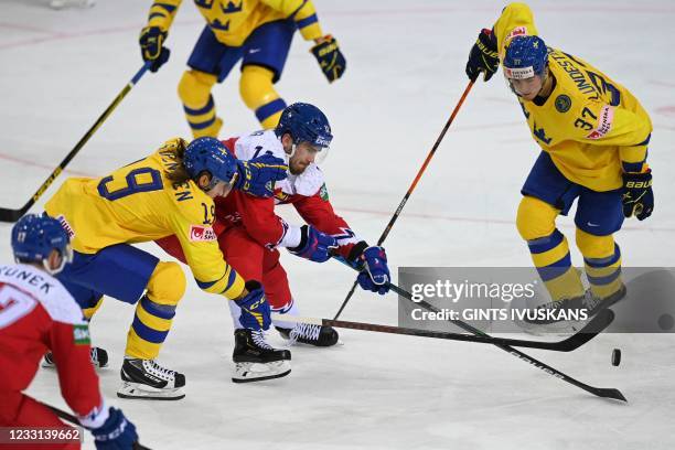 Sweden's forward Marcus Sorensen and Czech Republic's forward Filip Zadina vie during the IIHF Men's Ice Hockey World Championships preliminary round...