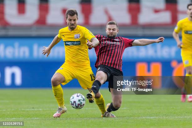 Kevin Wolze of VfL Osnabrueck and Marc Stendera of FC Ingolstadt 04 battle for the ball during the 2. Bundesliga playoff leg one match between FC...