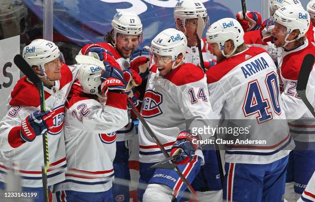 Nick Suzuki of the Montreal Canadiens celebrates his overtime winning goal against the Toronto Maple Leafs in Game Five of the First Round of the...