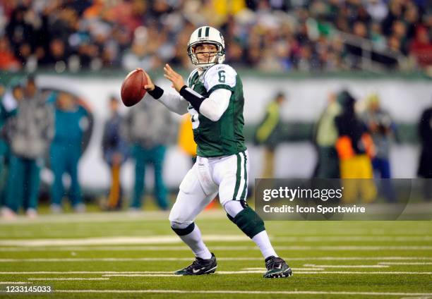 New York Jets quarterback Mark Sanchez runs out of the pocket looking to pass during the first half of the game at the New Meadowlands Stadium in...