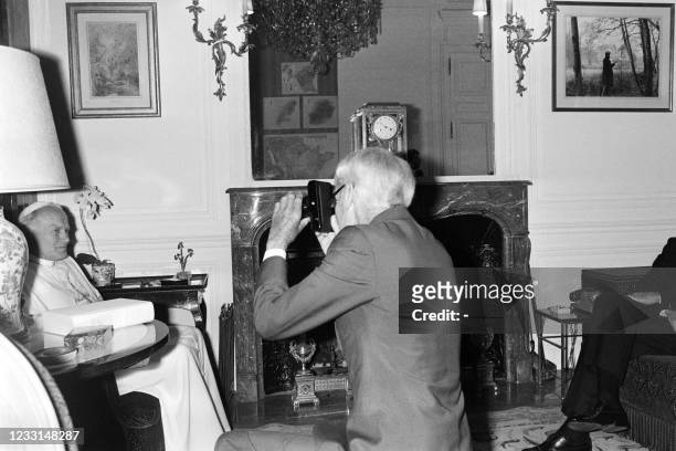 Pope John Paul II is photographed by French photographer Jacques Henri Lartigue at the Elysee Palace in Paris during his official visit in France on...
