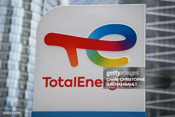 This photograph taken on May 28, 2021 shows the new TotalEnergies logo during its unveling ceremony, at La Defense on the outskirts of Paris. - Total...