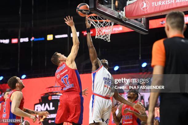 Anadolu Efes Istanbul's US-Armenian center Bryant Dunston and CSKA Moscow's German center Johannes Voigtmann vie during the Basketball Euroleague...